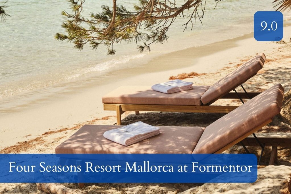 long sandy beach under pine trees at Formentor