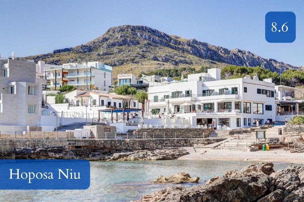 small hotel tucked against Cala Barques and the cliffs