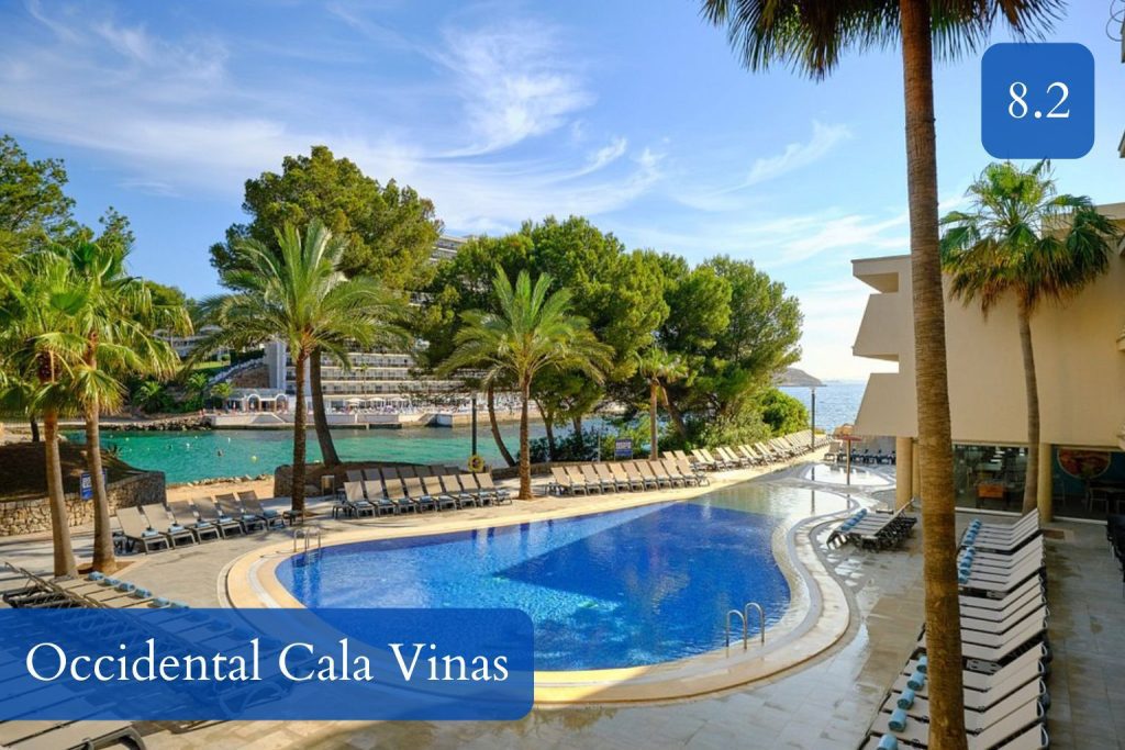 white-sand cove and resort pool on Mallorca’s southwest coast
