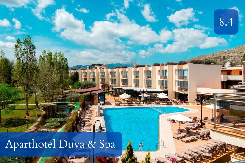 Swimming pool, gardens, and mountain surroundings at Aparthotel Duva & Spa near Port de Pollença, Mallorca.