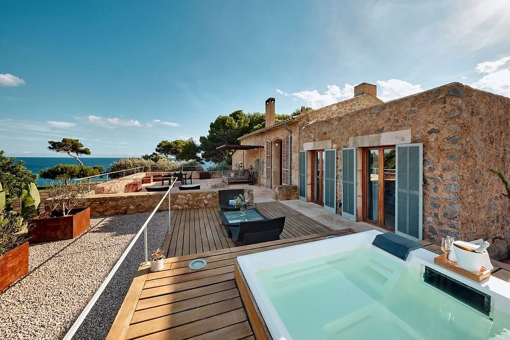 Luxury terrace with a private hot tub and panoramic sea views at Can Simoneta in Canyamel, Mallorca.