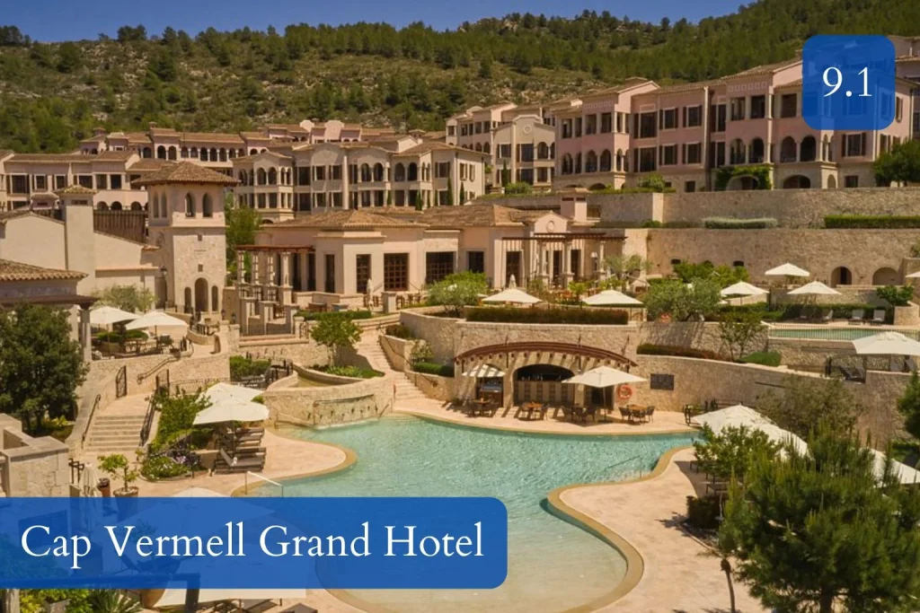 Main outdoor swimming pool surrounded by Mediterranean-style architecture at Cap Vermell Grand Hotel in Canyamel, Mallorca.