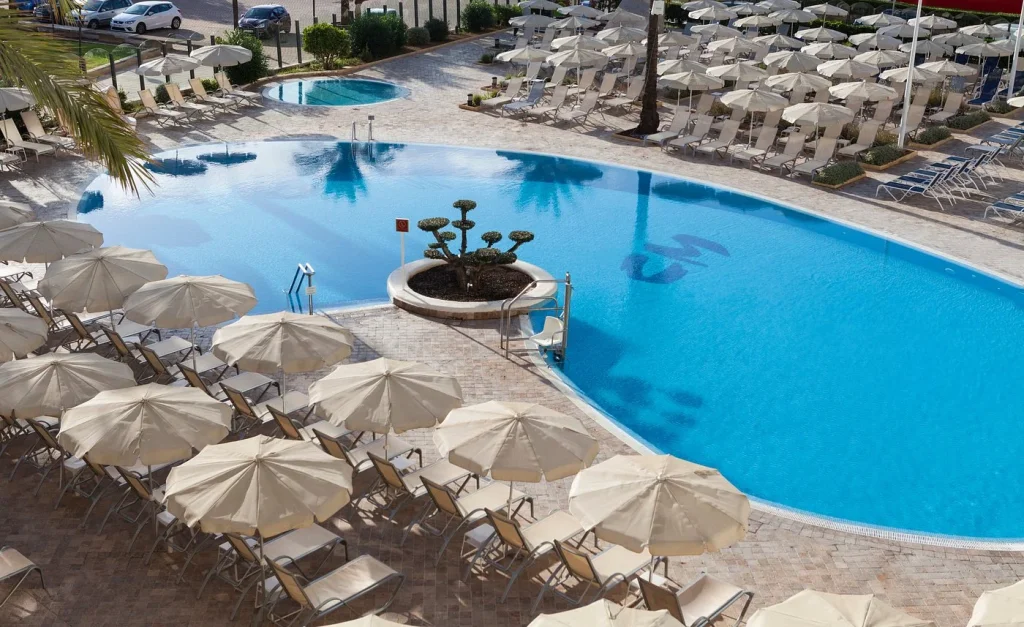 Lagoon-style main pool with sun loungers at CM Castell de Mar in Cala Millor, Mallorca.