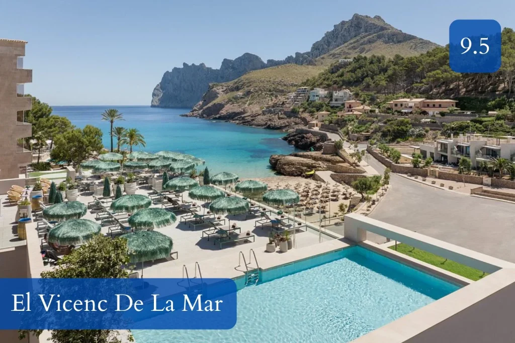 Seafront pool and Cala Sant Vicenç bay view at El Vicenç de la Mar in Mallorca.