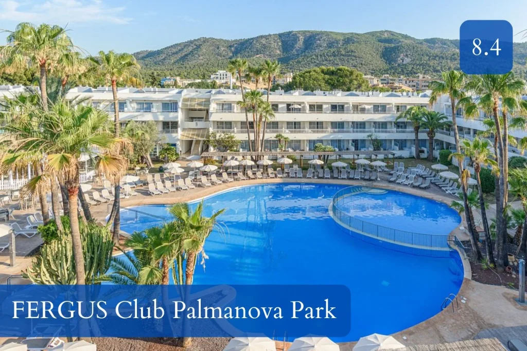 Large outdoor swimming pool surrounded by palm trees at FERGUS Club Palmanova Park in Son Caliu near Palmanova, Mallorca.