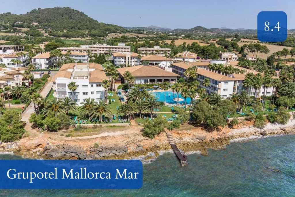 Aerial view of Grupotel Mallorca Mar with seafront gardens and swimming pools in Cala Bona, Mallorca.