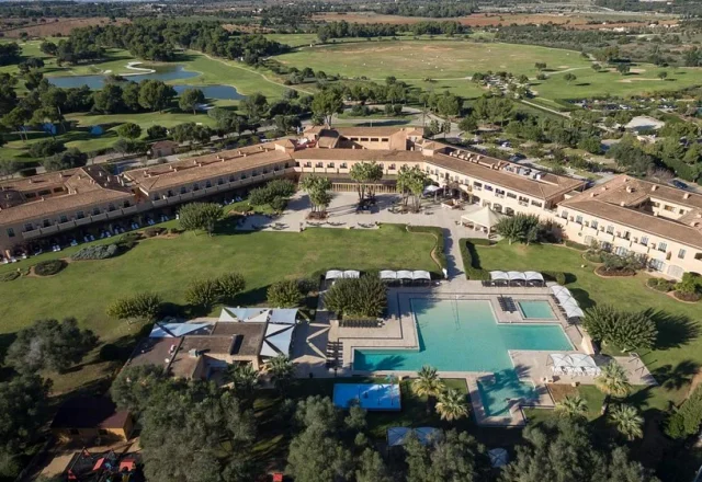 Aerial view of the pool area and golf course at Hacienda Son Antem Golf Resort in Llucmajor, Mallorca
