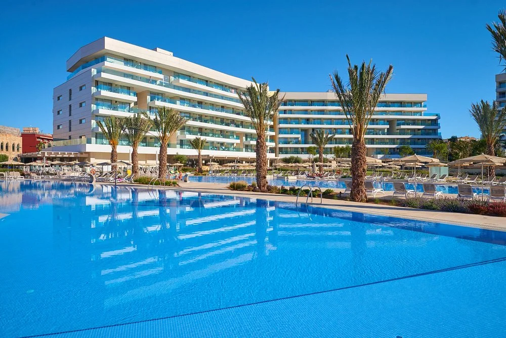 Large outdoor swimming pool and modern hotel exterior at Hipotels Gran Playa de Palma in Playa de Palma, Mallorca.