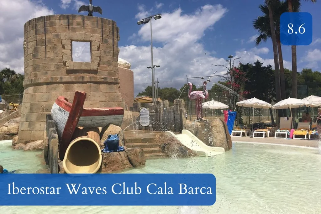Pirate-themed splash pool with castle tower, water slides, and fountains at Iberostar Waves Club Cala Barca in Cala Barca, Mallorca