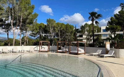 Outdoor pool with cabanas at Kimpton Aysla Mallorca in Santa Ponsa, Mallorca
