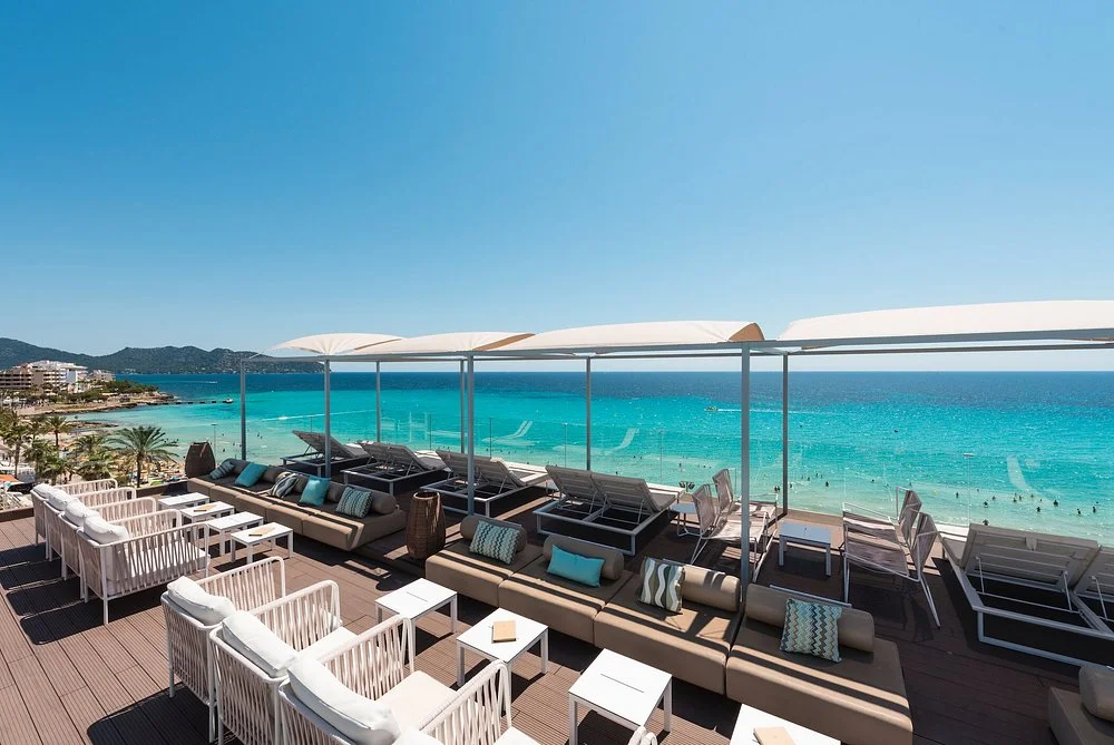 Rooftop sky bar with Mediterranean Sea views at Kyrat Amàrac in Cala Millor, Mallorca.