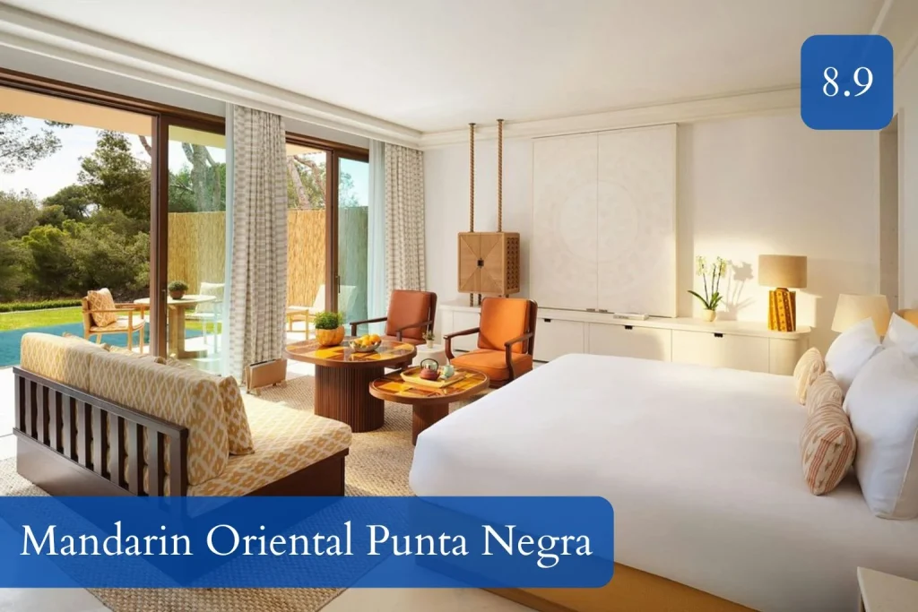 Spacious deluxe room at Mandarin Oriental Punta Negra in Calvià, Mallorca, with a garden terrace and pool view.