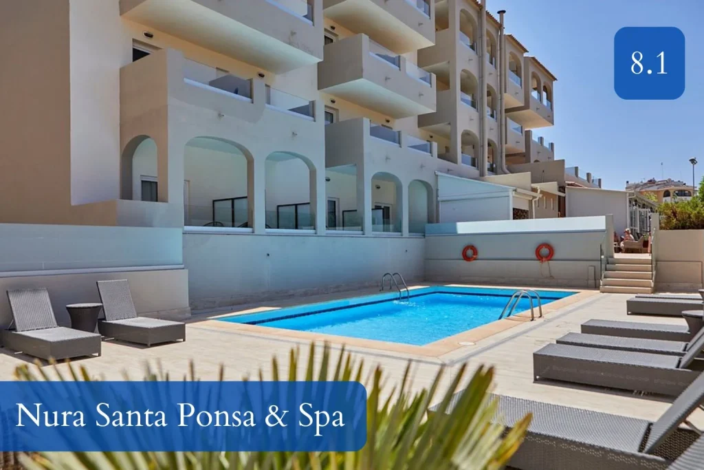 Outdoor pool surrounded by sun loungers and hotel balconies at Nura Santa Ponsa & Spa in Santa Ponsa, Mallorca