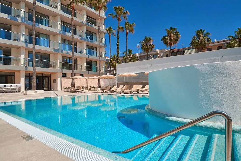 Main pool and apartment building at Protur Atalaya Apartments in Cala Millor, Mallorca.