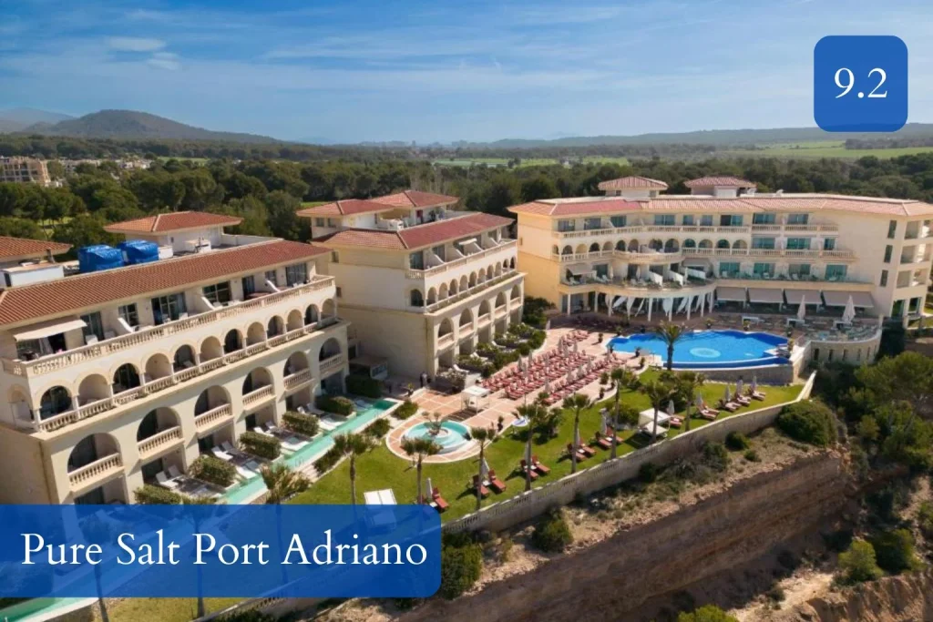 Aerial view of the resort, outdoor pools, and sun terrace at Pure Salt Port Adriano in Port Adriano, Mallorca