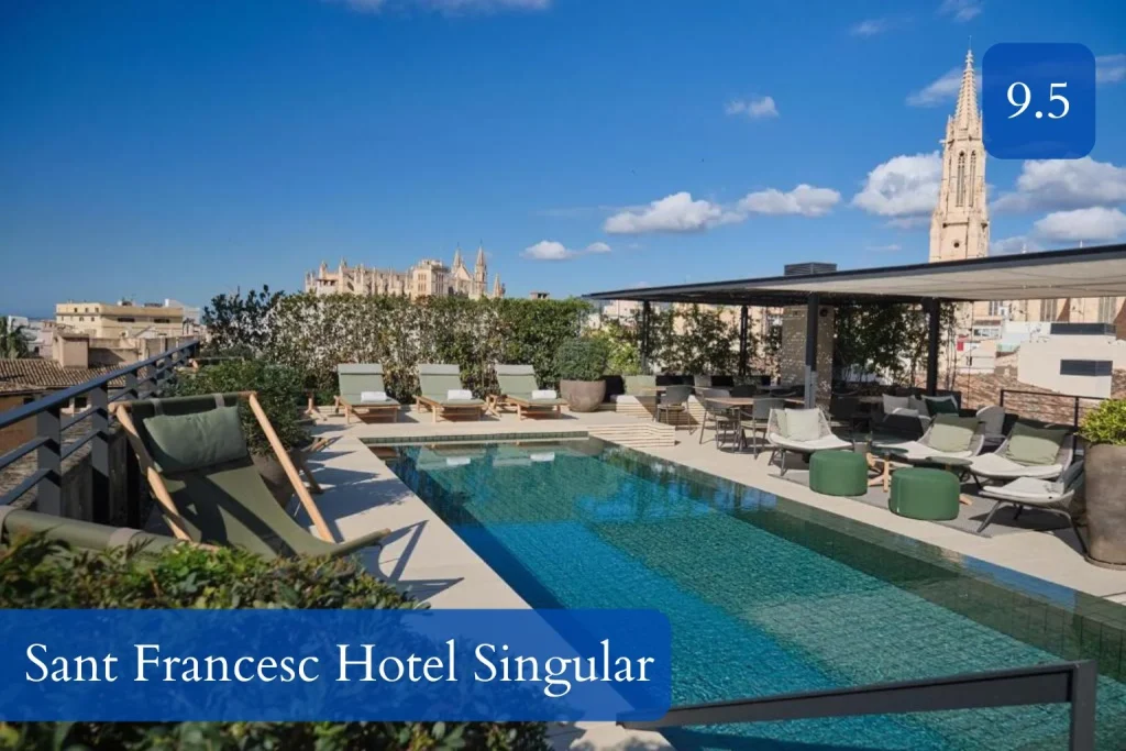 Rooftop swimming pool with sun loungers, lounge seating, and panoramic views of Palma Cathedral and the historic skyline at Sant Francesc Hotel Singular in Old Town Palma, Mallorca