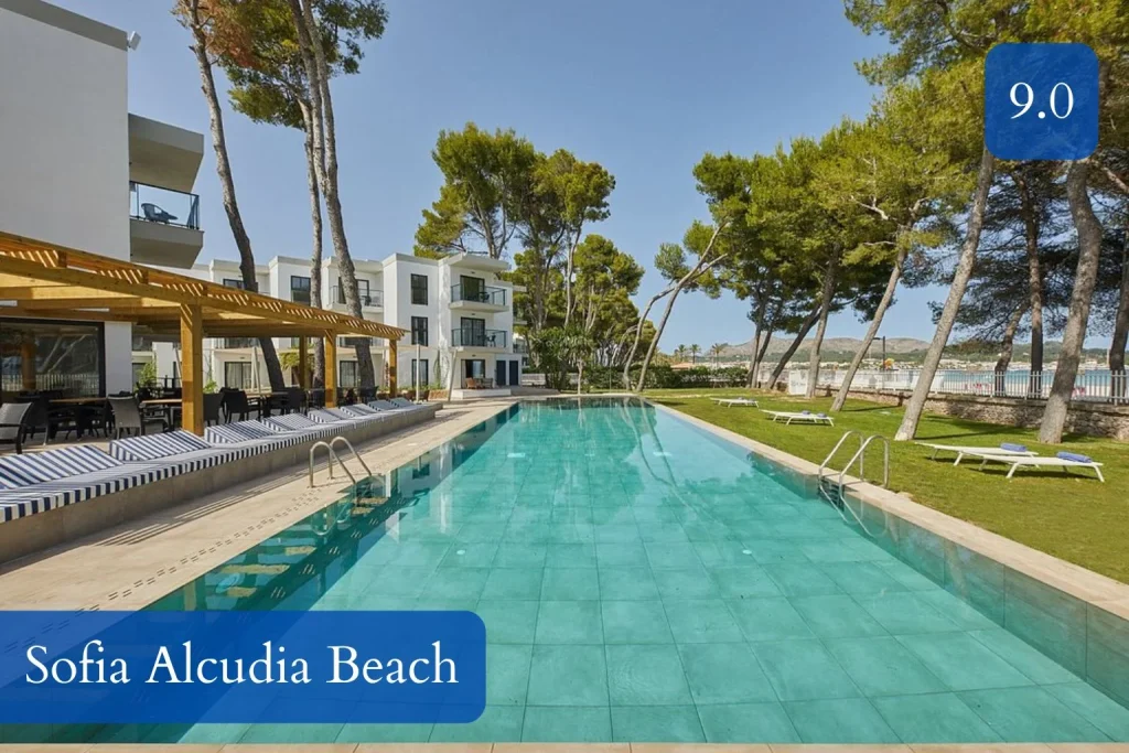 Swimming pool and landscaped grounds at Sofia Alcudia Beach in Playa de Alcúdia, Mallorca.