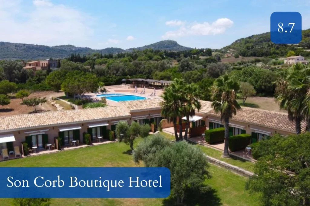 Aerial view of Son Corb Boutique Hotel with gardens and outdoor pool near Cala Bona, Mallorca.