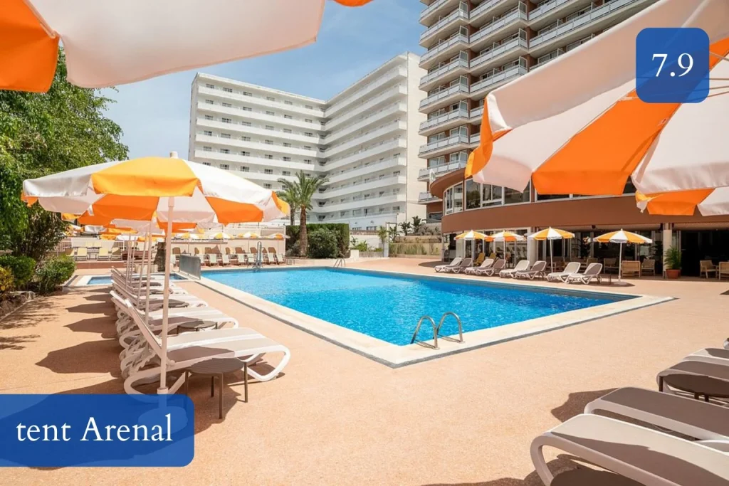 Outdoor swimming pool with sun loungers at tent Arenal hotel in El Arenal, Playa de Palma, Mallorca.