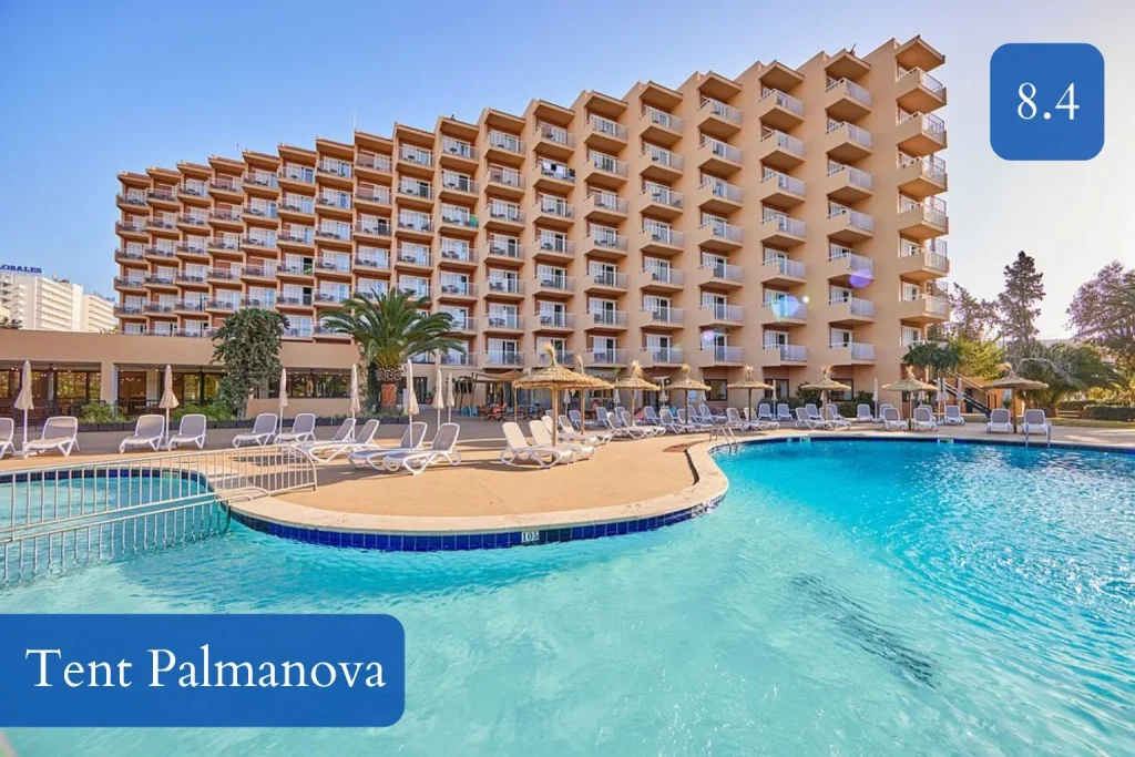 Large outdoor swimming pool with sun loungers at tent Palmanova in Central Palmanova, Mallorca.