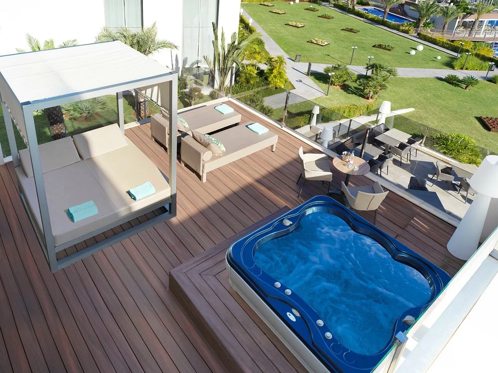 Luxury suite with private hot tub, Balinese bed, and sun terrace at Zafiro Palace Palmanova in Palmanova, Mallorca.
