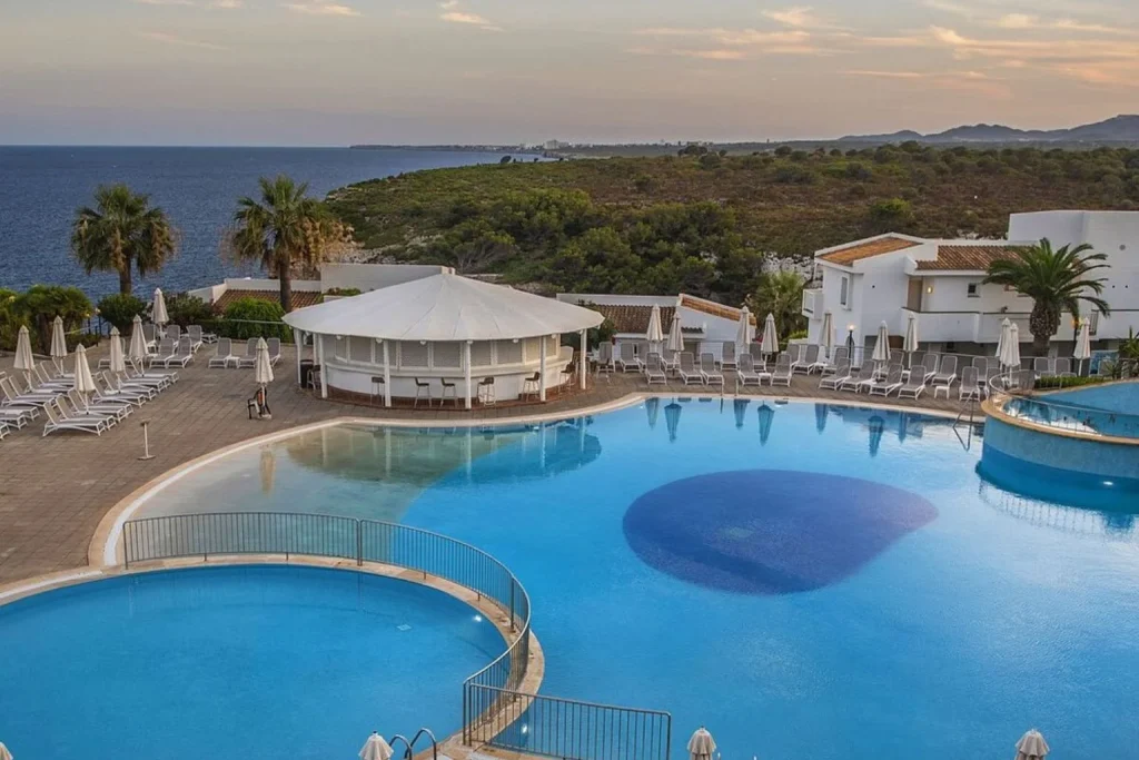 Main outdoor swimming pool overlooking the Mediterranean Sea at Blau Punta Reina Resort between Porto Cristo and Cala Mandia, Mallorca.