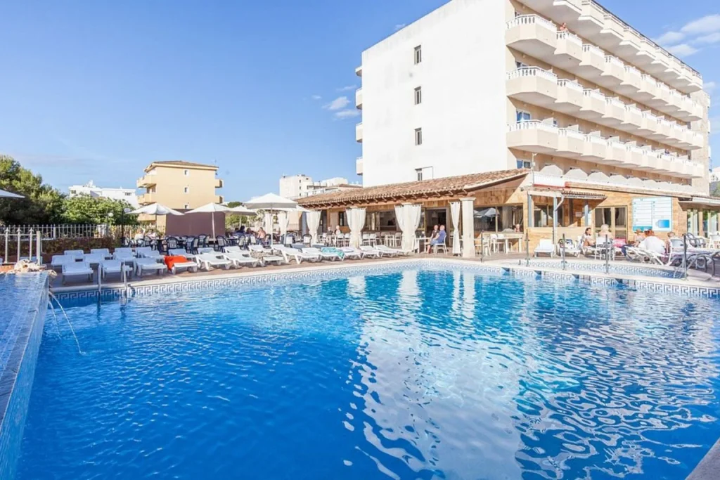 Outdoor swimming pool and sun terrace at BLUESEA Don Jaime in Cala Millor, Majorca.