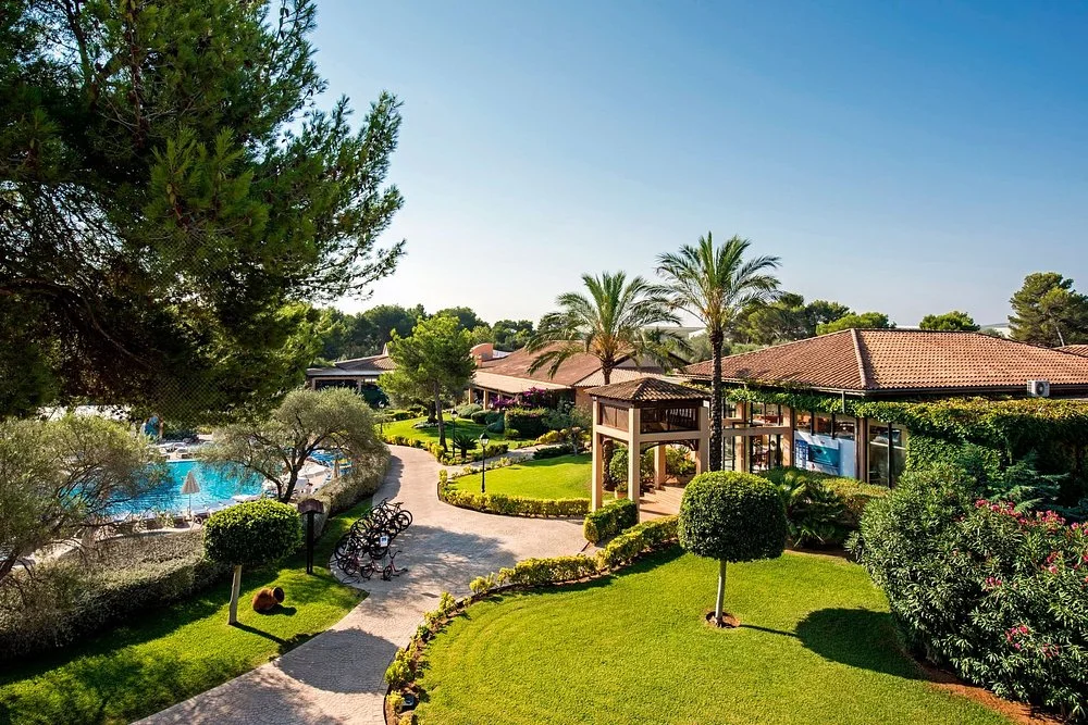 Resort gardens and walking path at Caprice Vell Mari Hotel & Resort in Can Picafort, Mallorca.