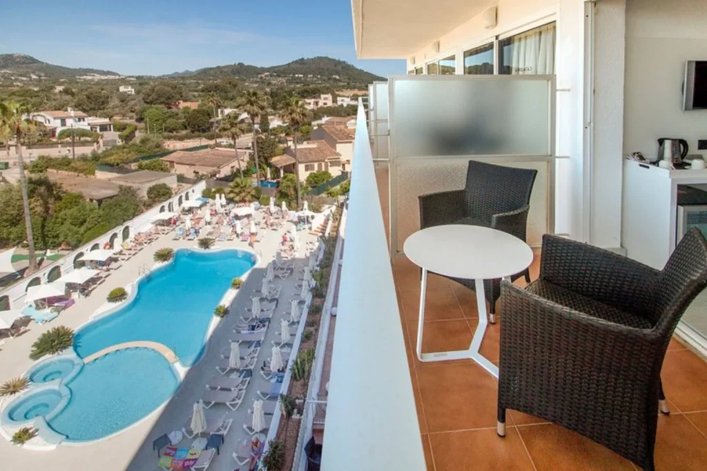 Private balcony overlooking the pool at Catalonia Del Mar in Cala Bona, Mallorca