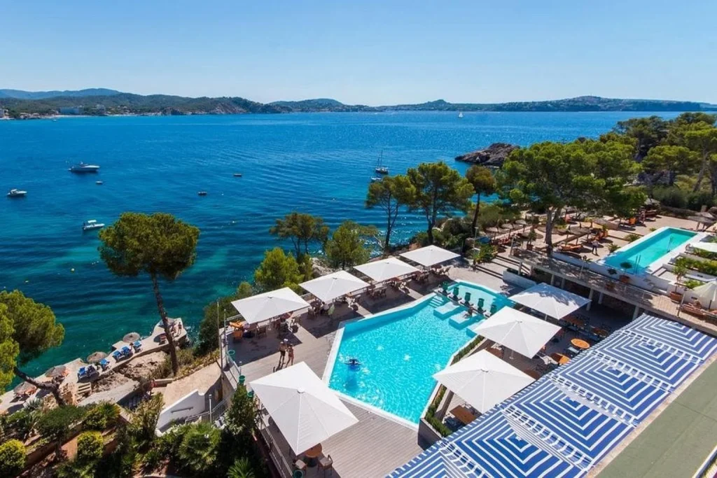 Aerial view of the seafront swimming pools overlooking the Mediterranean at Coronado Thalasso & Spa in Cala Fornells, Mallorca.