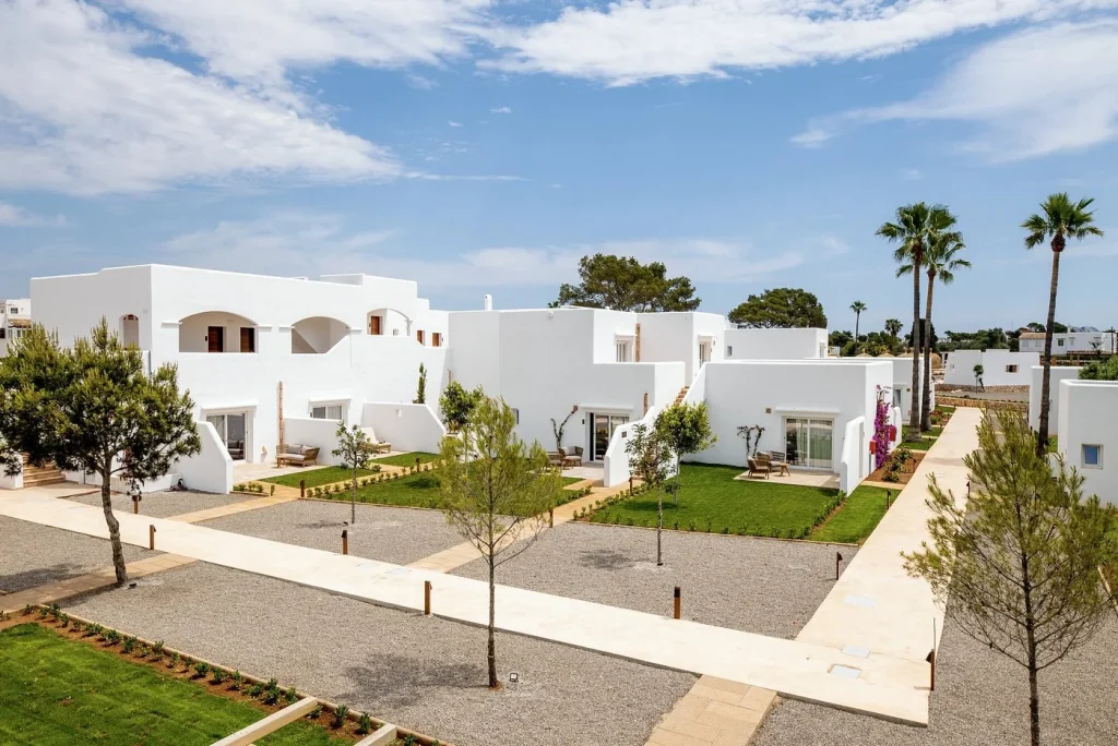 White Mediterranean-style villas and landscaped gardens at Eques Petit Resort in Cala d'Or, Mallorca.