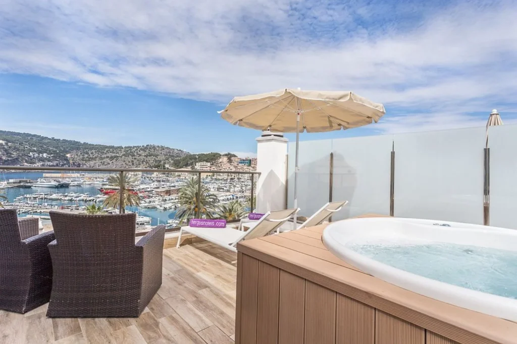 Private terrace with a hot tub, sun loungers, and marina views at Fergus Style Sóller Beach in Port de Sóller, Mallorca