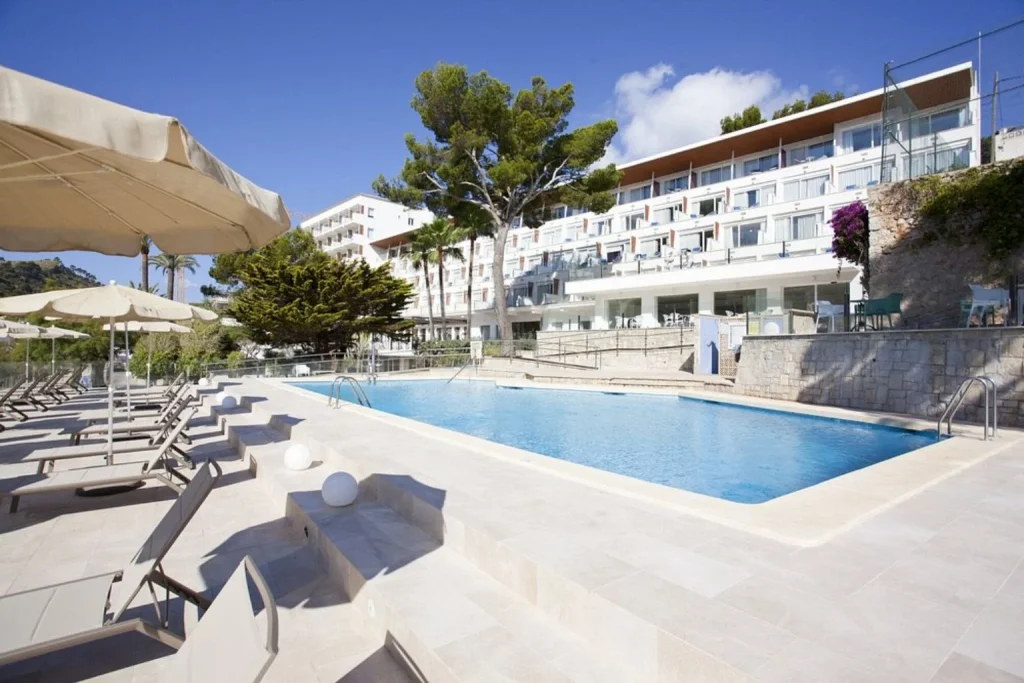 Main pool and modern hotel façade at Grupotel Molins in Cala Sant Vicenç, Mallorca