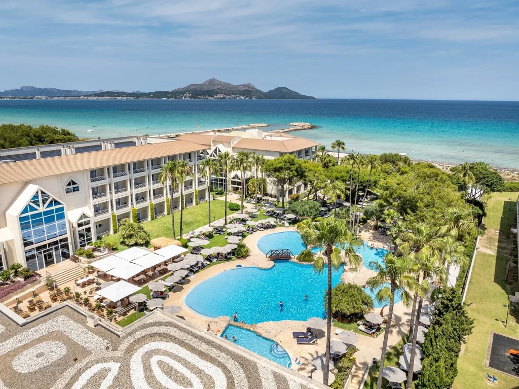 Lagoon-style pool and beachfront views at Grupotel Parc Natural & Spa in Playa de Muro, Mallorca.