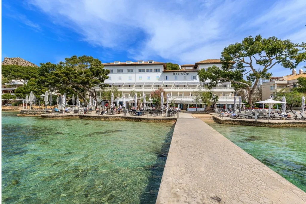 Waterfront hotel and private pier at Hoposa Illa d'Or in Port de Pollença, Mallorca.