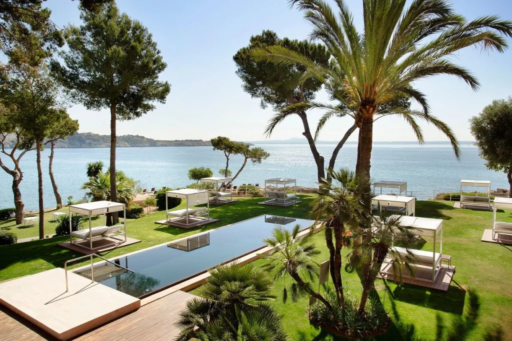Seafront pool and garden cabanas at Hotel de Mar Gran Meliá in Illetas, Mallorca.