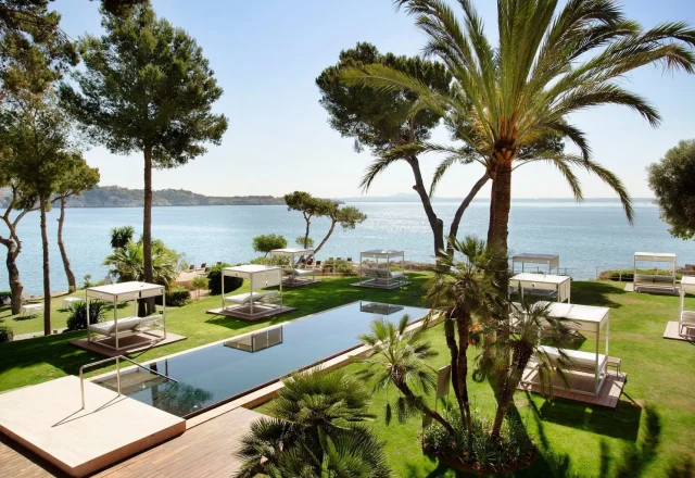 Seafront pool and garden cabanas at Hotel de Mar Gran Meliá in Illetas, Mallorca.
