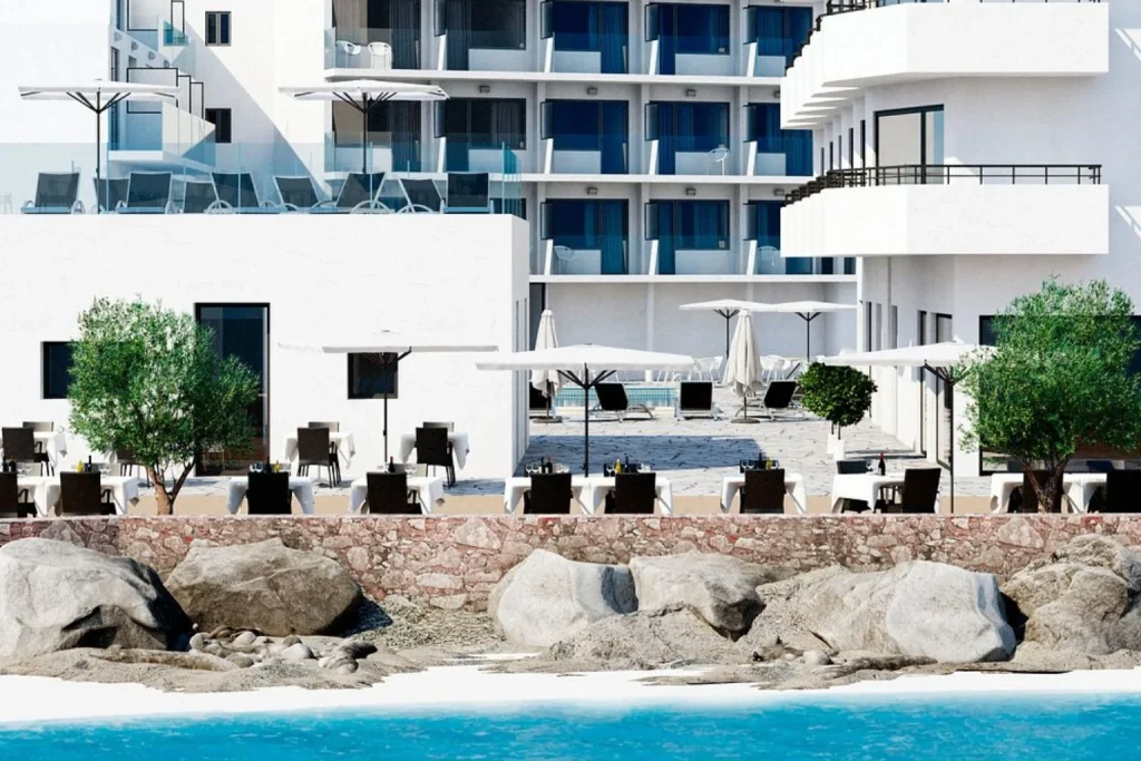 Modern beachfront exterior of Hotel Ilusion Moreyo overlooking the Mediterranean Sea in Cala Bona, Mallorca.