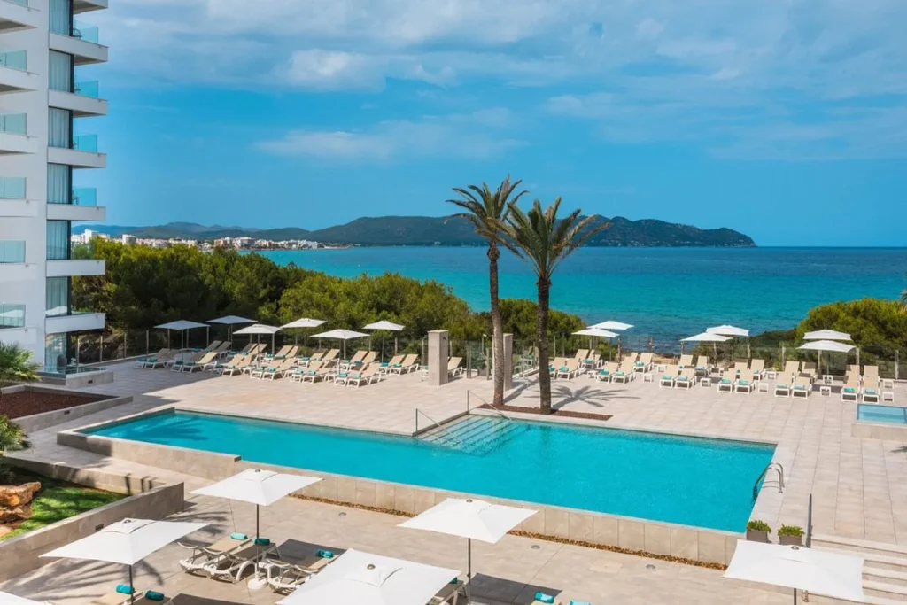 Seafront pool with Mediterranean views at Iberostar Waves Cala Millor in Cala Millor, Majorca.