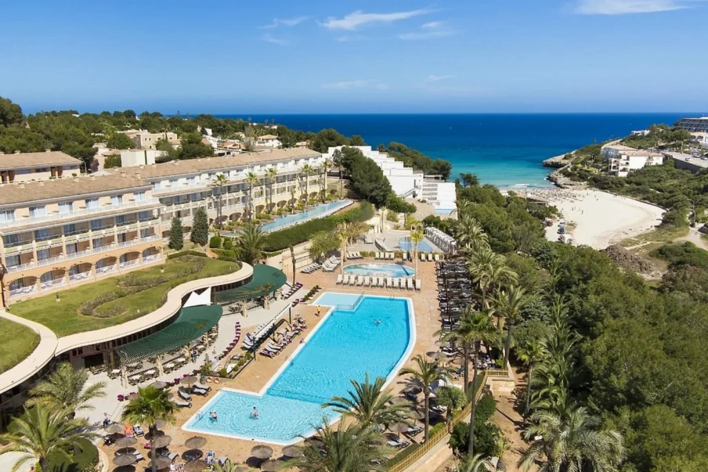 Hotel, pools and beach view at Insotel Cala Mandia Resort & Spa in Cala Mandia, Mallorca