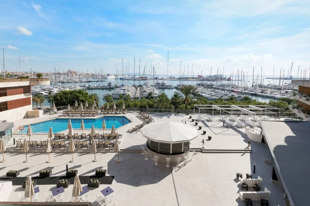 Outdoor pool and sun terrace with panoramic views of Palma Marina at Meliá Palma Marina in Palma.