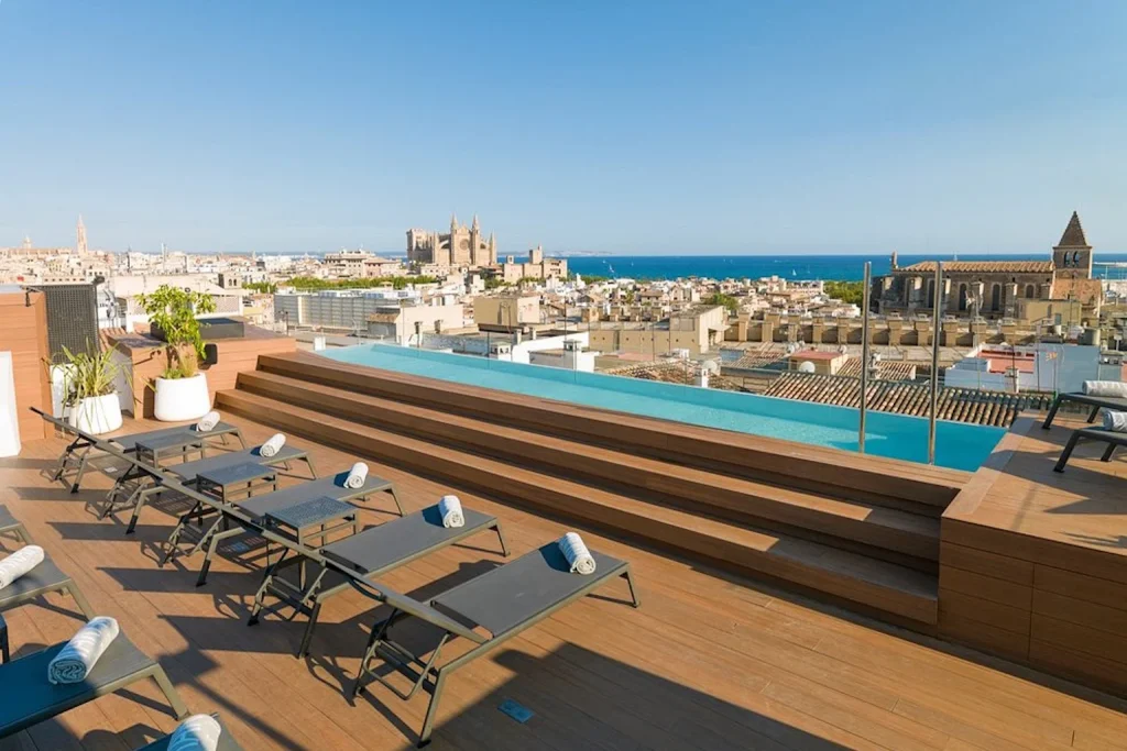 Rooftop infinity pool with city view at Nakar Hotel in Palma, Mallorca