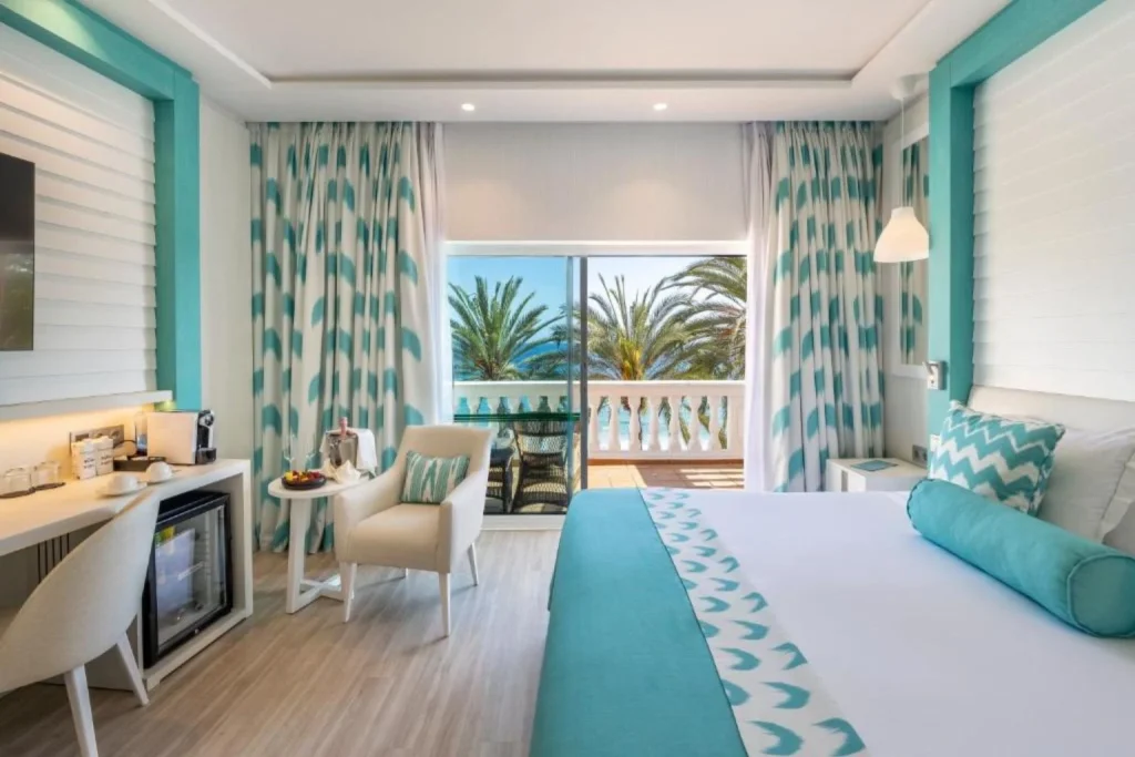 Sea view guest room with a private balcony at Nixe Palace in Palma, Mallorca.