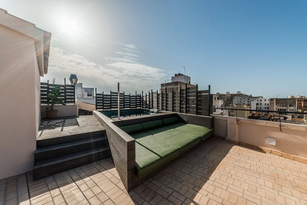 Private rooftop terrace with plunge pool and sunbed at Nou Baleares hotel in Palma.