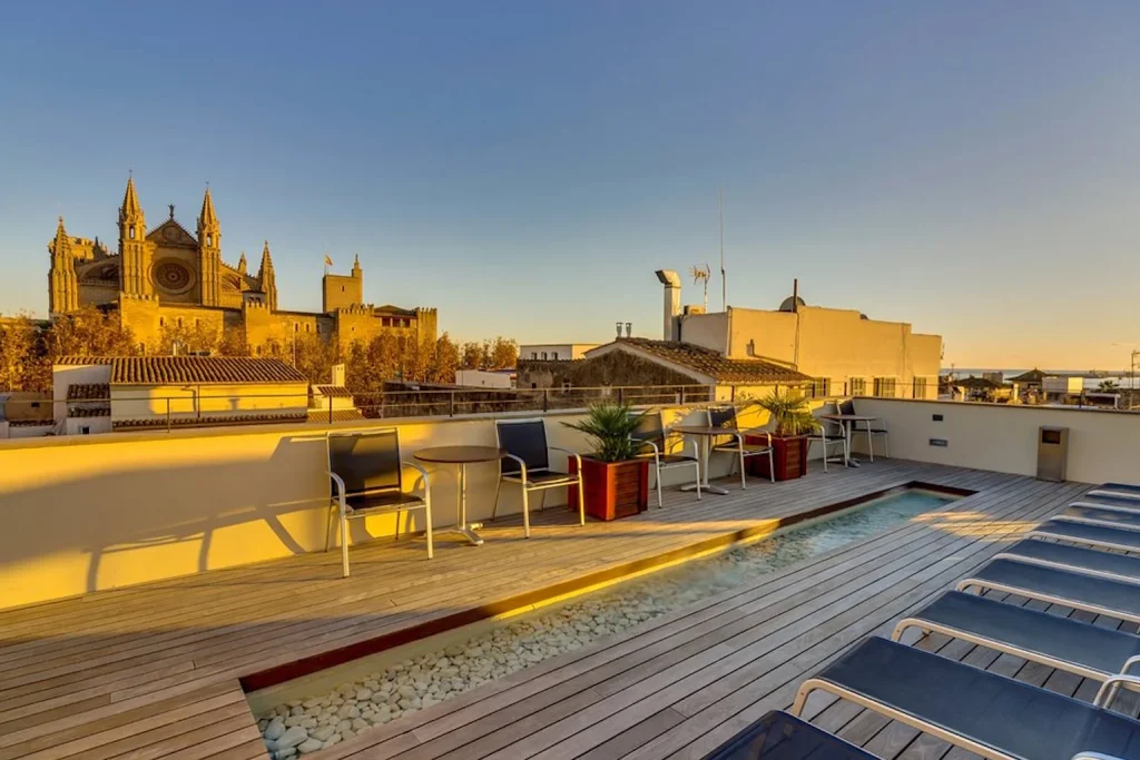 Rooftop terrace with cathedral view at Petit Palace Hotel Tres in Palma, Mallorca