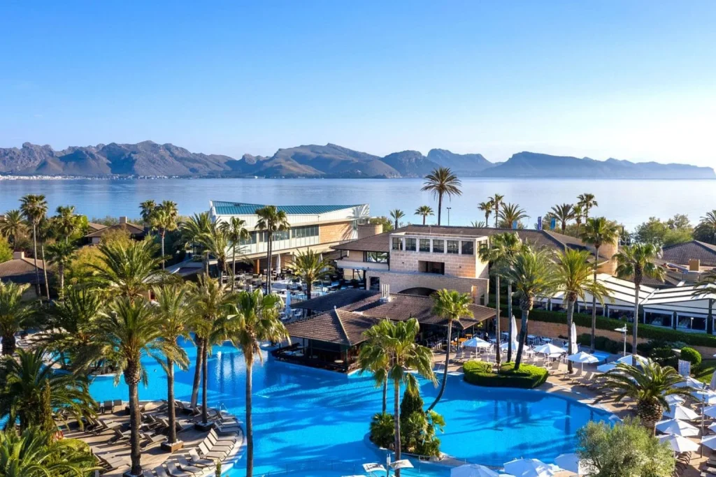 Lagoon-style pool with bay view at PortBlue Club Pollentia Resort & Spa in Alcúdia, Mallorca.