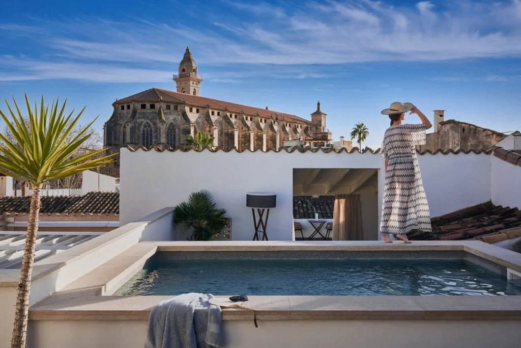 Rooftop plunge pool overlooking the cathedral and historic skyline at Posada Terra Santa in Palma de Mallorca.