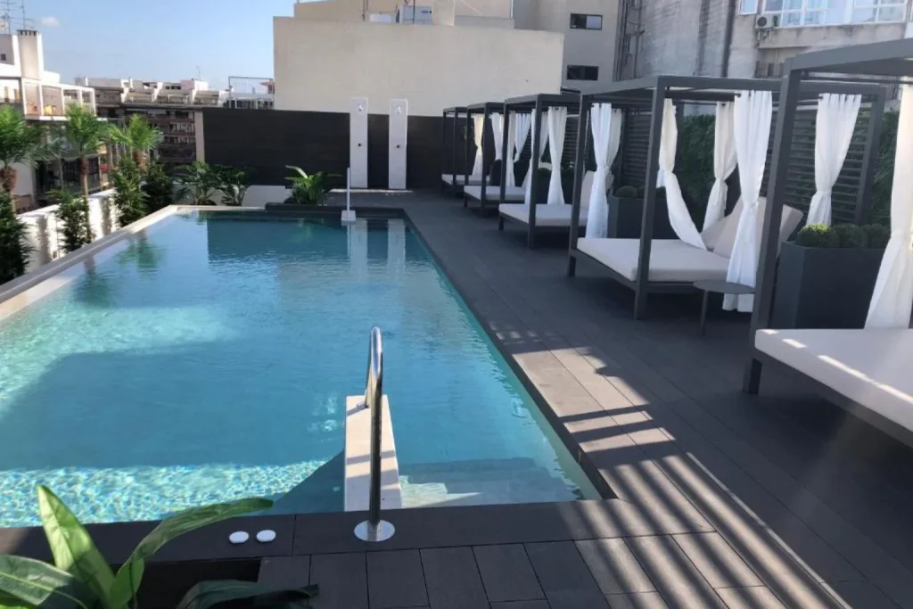 Rooftop pool with private cabanas at Protur Naisa Palma Hotel in Palma.