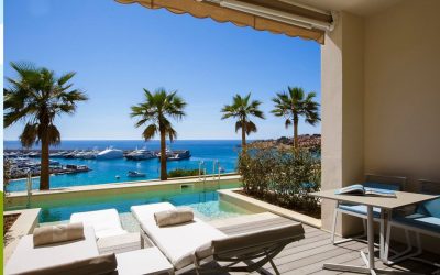 Private terrace with an infinity pool and marina views at Pure Salt Port Adriano Adults-Only hotel in Port Adriano.