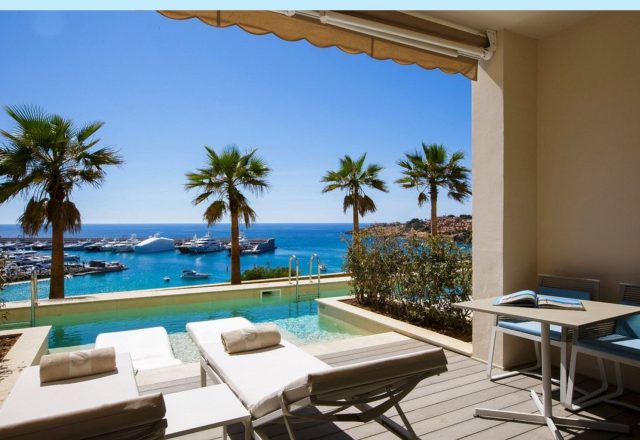 Private terrace with an infinity pool and marina views at Pure Salt Port Adriano Adults-Only hotel in Port Adriano.